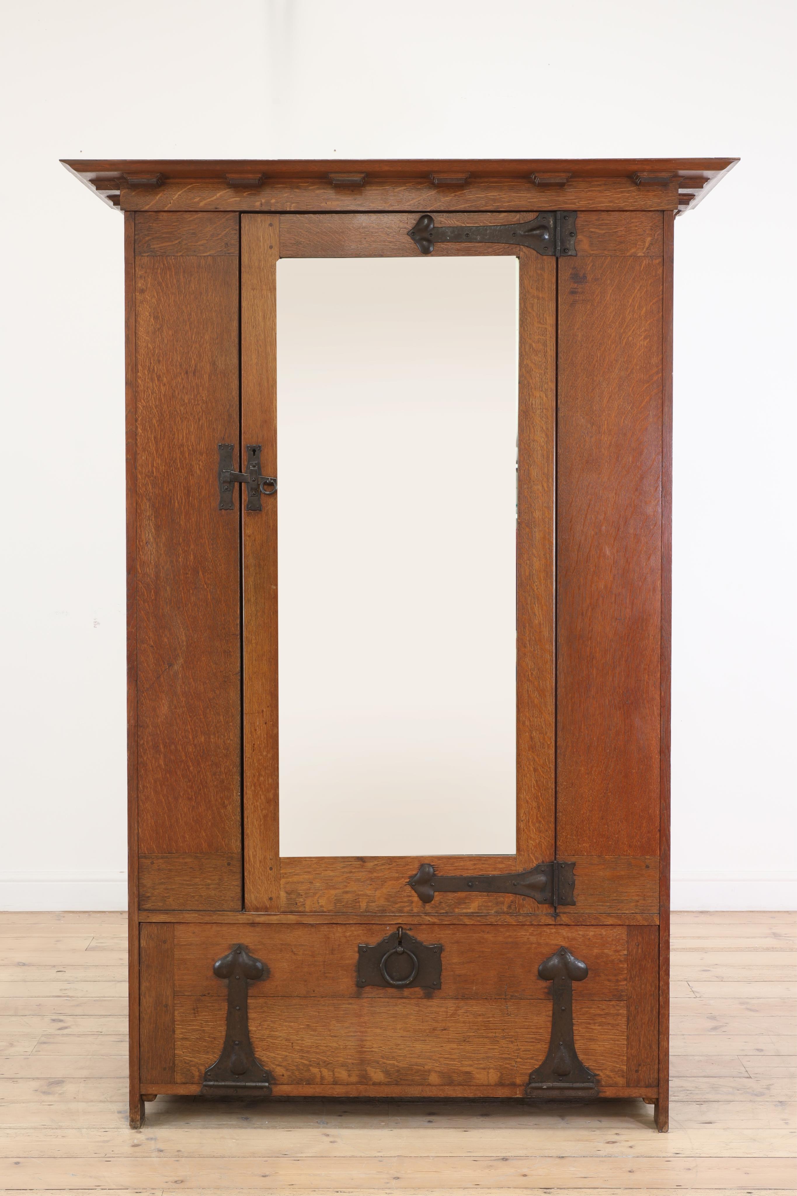 Ambrose Heal (1872-1959) for Heal & Son, London. A 'St Ives' oak wardrobe, c.1898, width 128cm, depth 61cm, height 189cm. Condition - good